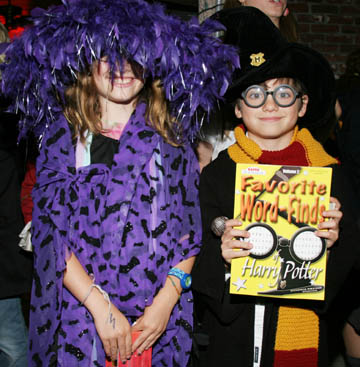 Witch (Lili Boyle) and Harry Potter (Jake Boyle) were costume contest winners as they waited for the sixth Harry Potter book to go on sale at Village Books. See story and photos on Page 3. Photo: Gayle Goodrich