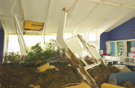 A mudslide bringing part of a patio and a tree from a home on Rimmer down the hillside into Temescal Gateway Park caused significant damage to an unoccupied building used by the Palisades Jewish Early Childhood Center. The 25' x 22' room was filled with 3 to 4 feet of mud, and a couch and window were pushed from one side of the room to the other.