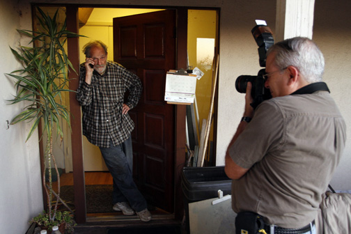 Palisadian Reed Saxon, who won a Pulitzer Prize in 1993 for his classic photo of Bill Clinton playing the saxophone, is shown here photographing Nobel Prize winner Lloyd Shapley early Monday morning at the professor's Pacific Palisades home. Photo: Jonathan Alcorn