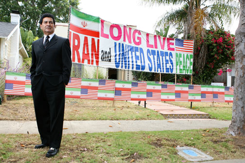 Seyed Maghloubi stands proudly in front of his Hartzell Street home. Rich Schmitt/Staff Photographer