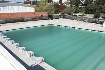 Even though the Maggie Gilbert Aquatic Center's pools are now filled with water, the center is not scheduled to open until at least October 1. The competition pool, with starting blocks already in place (left) is configured to have 25-meter lanes. Rich Schmitt/Staff Photographer