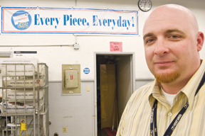 Jason Miles, 33, in the mail-processing lobby of the Post Office on La Cruz Drive. This month, he was reassigned back to Pacific Palisades, where he oversees the sorting and delivery of 50,000 pieces of mail every week.