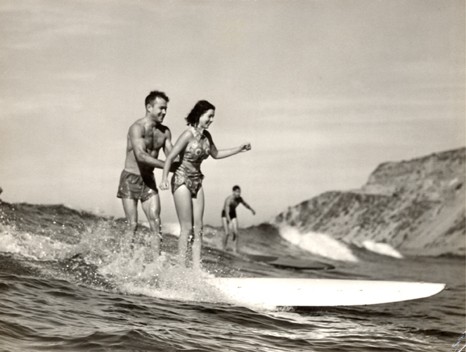 Monica Roche cut a trim figure on a surfboard.