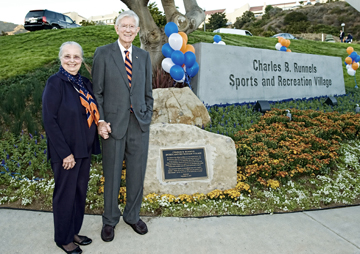 Pepperdine University Chancellor Emeritus Charles Runnels and his wife Amy Jo stand in front of the plaque and sign named in his honor at a dedication ceremony Monday at the Malibu campus.