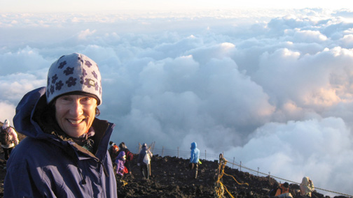 Pacific Palisades realtor Joan Sather is exhilarated as she reaches the summit of Mt. Fuji in Japan at dawn on August 25, accompanied by her husband, Kent.