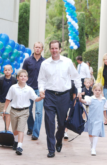 Mark Holscher brings his children Luke (second grade) and Gemma (kindergarten) to their classes.