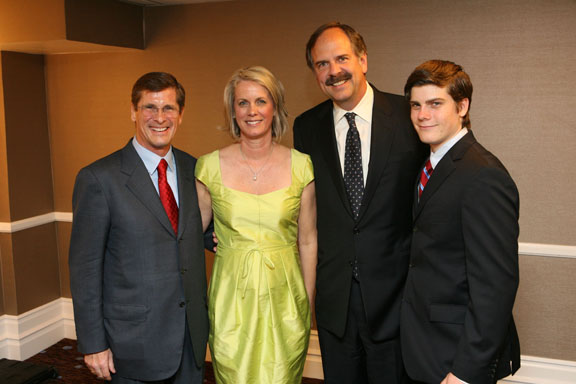Bill Simon with his wife Cindy (whose lime dress was the talk of the event), Olympic swimmer John Naber, and the Simons