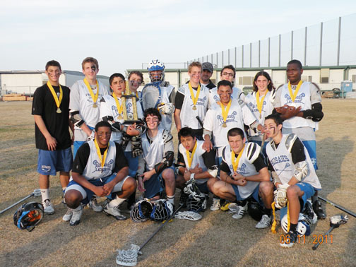  The Dolphins team, seated from left: Johnathan Jones, Nick Jaffe, Spencer Sawai, Jack Jordan, Ryan Angelich; standing from left: Daniel Gurvis, Chris Groel, Jack Wada, Evan Greene, Josh Roback, Jack Wyman, coach Gus Campos, Danny Hernandez, Dylan Coleman, Kellen Ware and Darrien Sturgis.