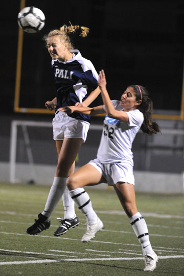 PaliHi junior forward Katie van Daalen Wetters leaps over an El Camino Real defender for a header.