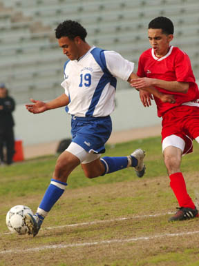 PaliHi striker Henry Argueta plants to shoot on a partial breakaway during Monday's 2-0 Western League soccer victory over Westchester.