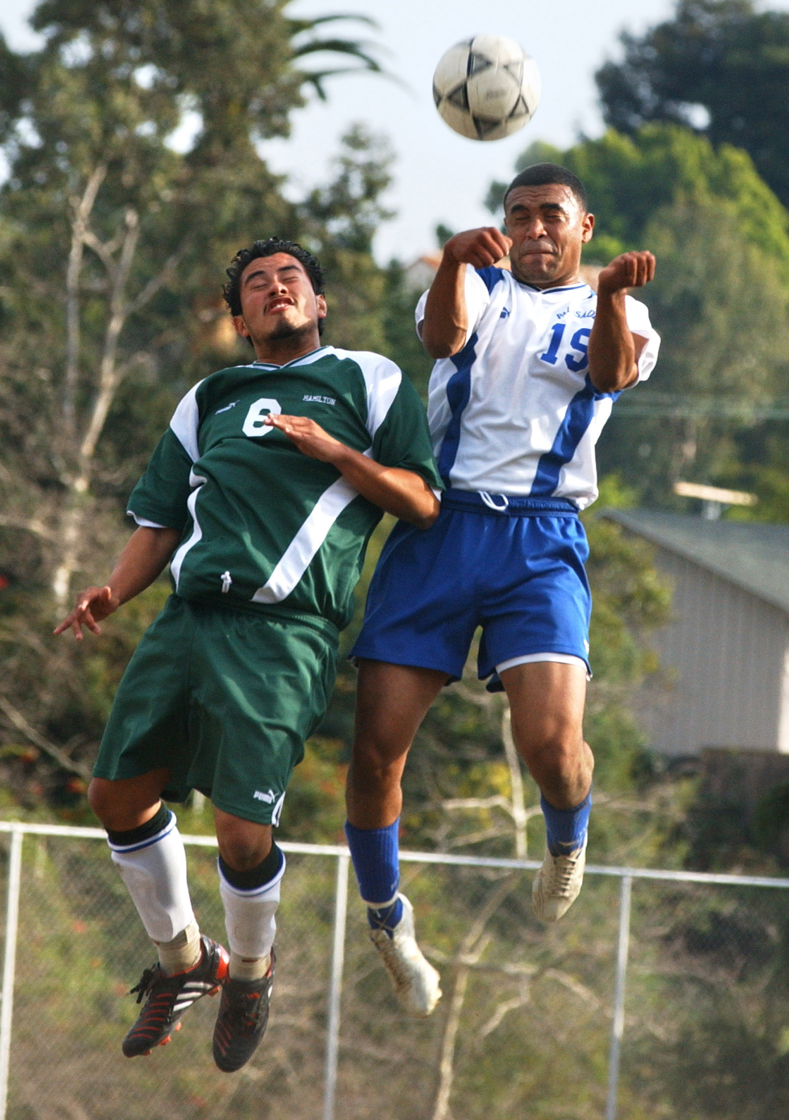 Palisades' Henry Argueta (right) heads the ball away from a Hamilton forward in last Thursday's game at Stadium by the Sea.