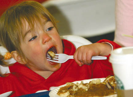 Even at 19 months, Rose Morris ate her fair share of pancakes while actress Mary McDonnell, forced inside by rainy weather, tossed the first pitch of the Palisades Pony Baseball Association