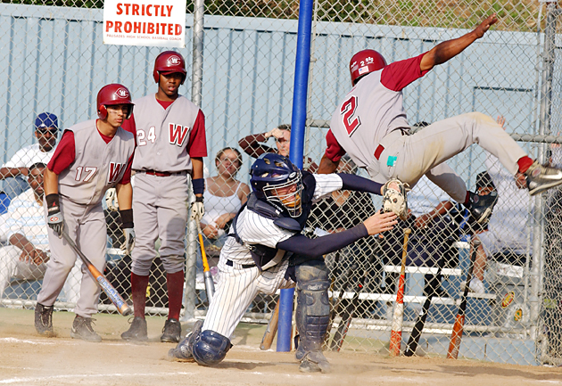 Palisades catcher Tim Sunderland tags out Westchester runner Basilio Martinez at home plate to end Tuesday's Western League showdown at George Robert Field.