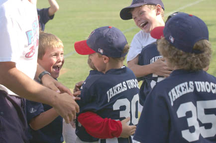 Pinto Indians celebrate after the final out of last Thursday's PPBA World Series at the Palisades Recreation Center.
