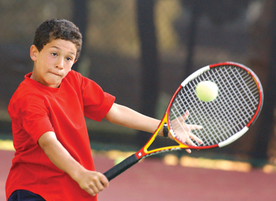 Eduardo Nava executes a textbook backhand volley during a live ball drill at the Palisades Tennis Center, where he trains.