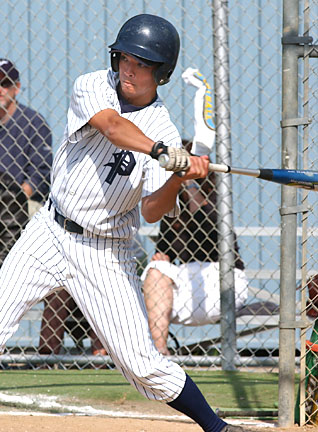 Right fielder Kevin Seto strokes a single to score another run for the Dolphins, who improved to 7-0 in the Western League.