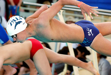 Junior Gavin Jones dives into the pool to begin his leg of the 200 freestyle relay at last Wednesday's City finals meet.