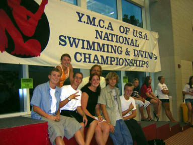 Paly swimmers Alexa Merz, Cara Davidoff, Peter Fishler, Dan Fox, Paris Hays and Brian Johnson with coach Adam Blakis at the YMCA Long Course Nationals in Baltimore, Maryland. Photo courtesy of Cara Davidoff