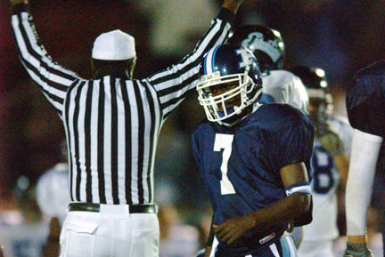 Raymond Elie (#7) looks away as the referee signals a touchdown in the third quarter of last Friday night's season opener at Stadium by the Sea. Palisades lost to Sylmar 47-0.