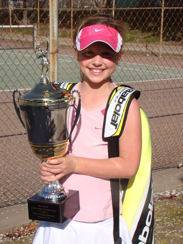 ALL SMILES: 10-year-old Palisadian Chloe Bendetti shows off her championship trophy after she won the Eight Annual Ramada Junior Open in February.