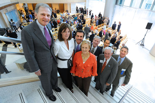 Pacific Palisades residents on hand for the Howard Keck Center ribbon-cutting ceremony included, from left, Steaven Jones, Cindy Connolly, Mark Gibello, Joan Michel, Bill Mortensen, Jack Michel, Bill Garland and Bob Klein. All are Saint John's Health Center Foundation trustees save for Joan Michel.