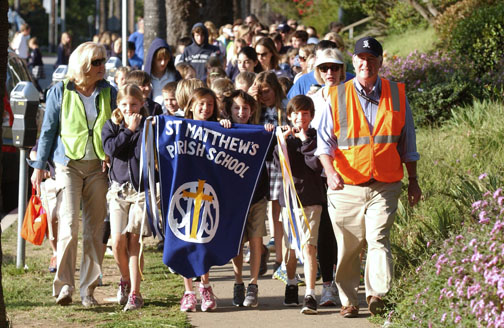 Third grade teachers Bonnie Mazziotta (left) and Patti Stennett accompany Head of School Stu Work during the school's annual Founders Day Walk. Third graders carrying the banner are (left to right) Josie Vogel, Katrina Mortenson, Charlie Albert and Witt Kolsky. Rich Schmitt/Staff Photographer