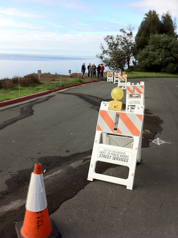 A portion of Asilomar Boulevard (opposite Almar Avenue) has been blocked off because of damage caused by an active landslide under the street and hillside, overlooking Santa Monica Bay. City officials met with nearby residents on Monday to discuss a possible fix. Photo: Sue Pascoe