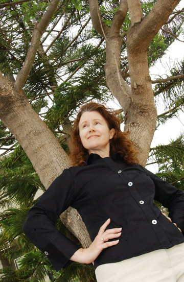 Wendy Alkire Suhr enjoys the jacaranda tree in her front yard on Chautauqua.