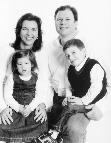The 2003 family Christmas photo of the Taylor family: parents Colette and Jeff, children Bayden and Preston.