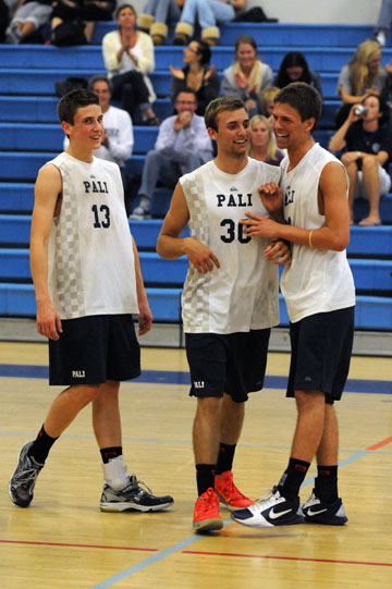 PaliHi volleyball players Chance Earnest, Alex Frapech and captain Jack Scharf celebrate after winning a key point in last week's victory over Carson.
