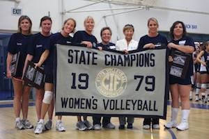 Coach Gayle Van Meter and members of her team hold up the 1979 state championship banner at PaliHi's first girls' volleyball reunion Saturday.
