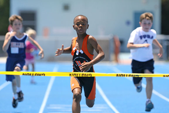 Eight-year-old Mikey Corrin blazes to the finish line in the boys? 50-meter dash in a record time of 7.97 seconds.