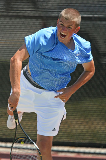 Junior Chance Earnest (white) shows his disappointment following the Dolphins straight-set loss to Granada Hills in the City finals on Saturday at Venice High. Rich Schmitt/Staff Photographer