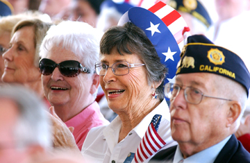 Left to right, Post 283 Auxiliary members Vi Walquist, Ruth Hackney and Susie Johansen and Post 283 Commander John Johansen listen to a speech at the dedication of the new Veterans Home on the VA grounds.