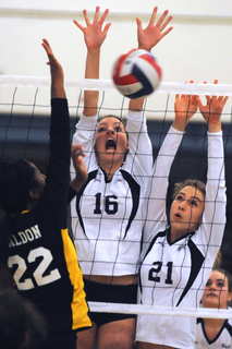 Teal Johnson (left) of Palisades hits through a Venice block during Monday's Western League match. Photo by Jared Rosen