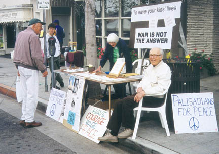 In February 2002, during the Bush Administration's buildup to the Iraq invasion, Harold Waterhouse helped man the Palisadians for Peace information table during the Swarthmore farmers  market. He handed out stamped postcards that read:
