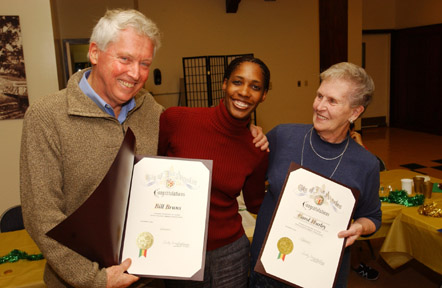 Monique Ford of Councilwoman Cindy Miscikowski's office, presented commendations to Community Service Award winners Bill Bruns and Carol Hurley at last Thursday's Community Council meeting.